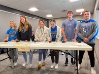 At the ESU 8 competition in Neligh, Mya Johnson, Abigail Cone, Aubrey Hanson, Josie Painter, Nickolas Efta, and Colter Anderson wait for the first round to begin.