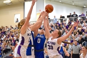 Hadley Wragge goes up for the shot under the basket in the district final game against Milford.