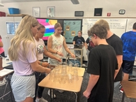 Students complete a cup stacking icebreaker in the FCCLA kickoff meeting.