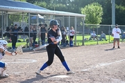 Pitcher Kylie Dvorak hits a single in the Ponca game on Thursday.