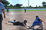 In the first game of the Wayne tournament against Twin River, Athena Bretschneider safely slides into home.