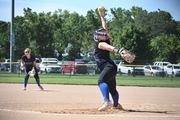 One of Pierce's pitchers, Kaelyn Halsey looks to strike out the batter. Also pictured is shortstop Evelyn Skrdla.